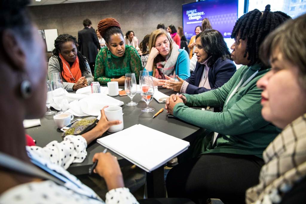 Women sitting at table in discussion