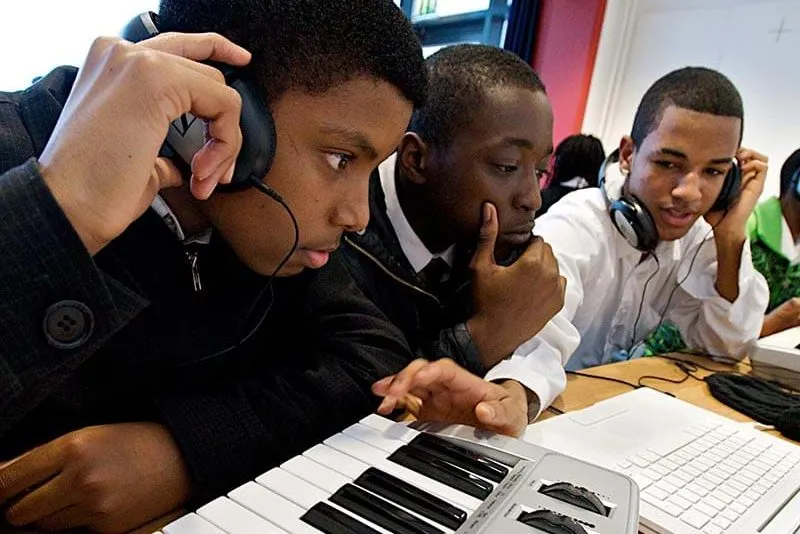 Young people training with computers and music equipment. 2008. Photo Credit: ©Alexis Maryon/PYMCA.